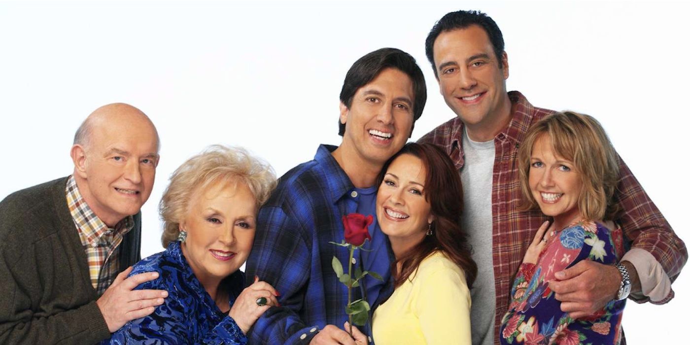 Frank, Marie, Ray, Debra, Robert, and Amy in an Everybody Loves Raymond promo photo smiling and embracing each other