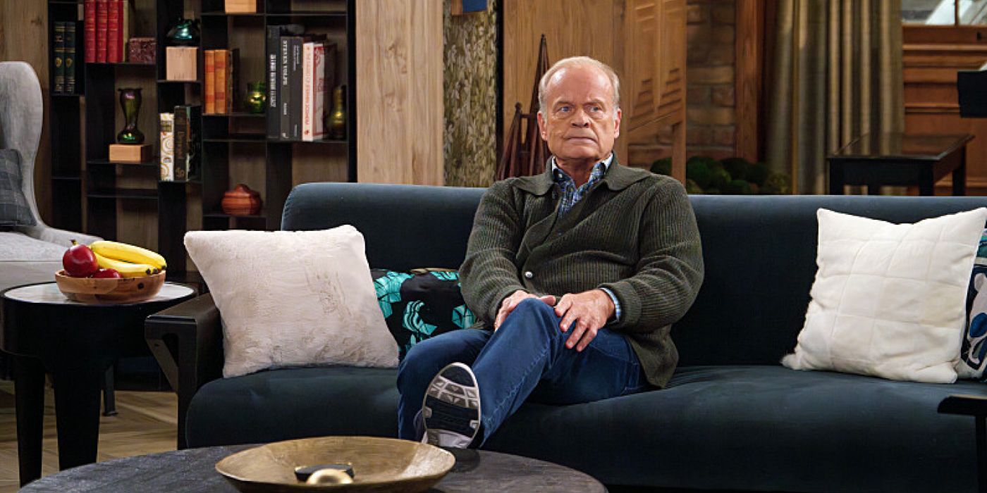 Frasier sitting on his couch in his apartment in Frasier reboot episode 9