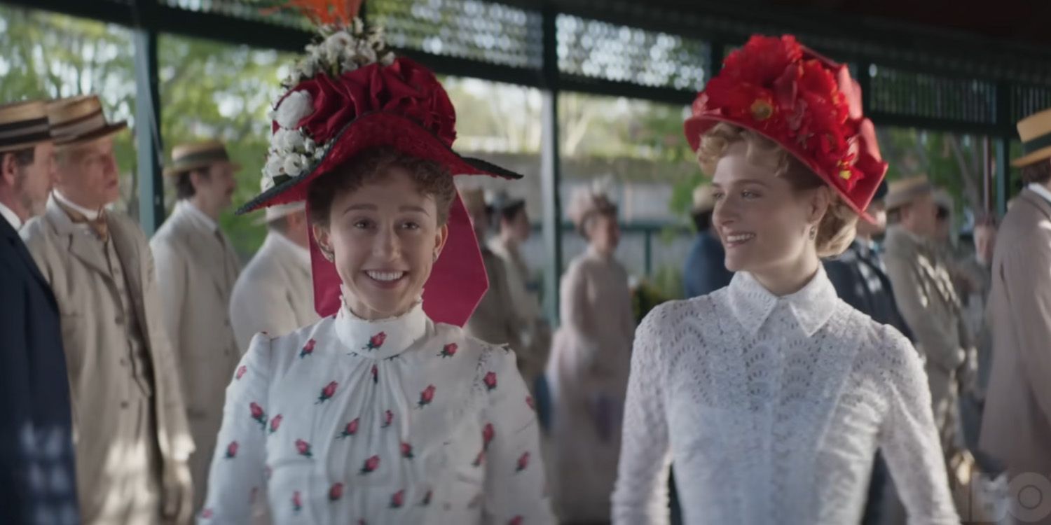Taissa Farmiga as Gladys and Louisa Jacobson as Marian dressed in white and smiling at each other in The Gilded Age.