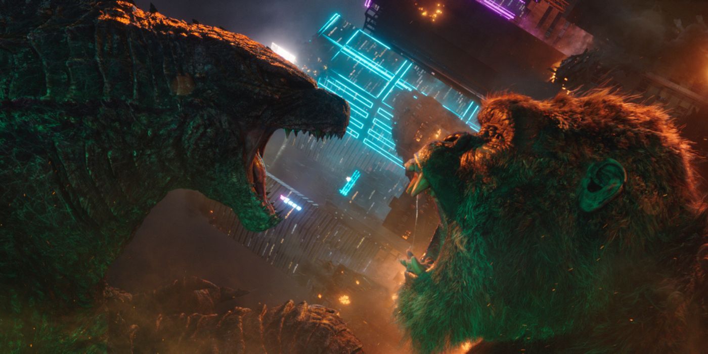 Godzilla and Kong roaring at each other in front of buildings in Hong Kong in Godzilla vs. Kong