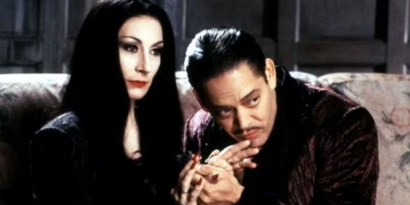 Gomez kissing Morticia Addams hand in The Addams Family