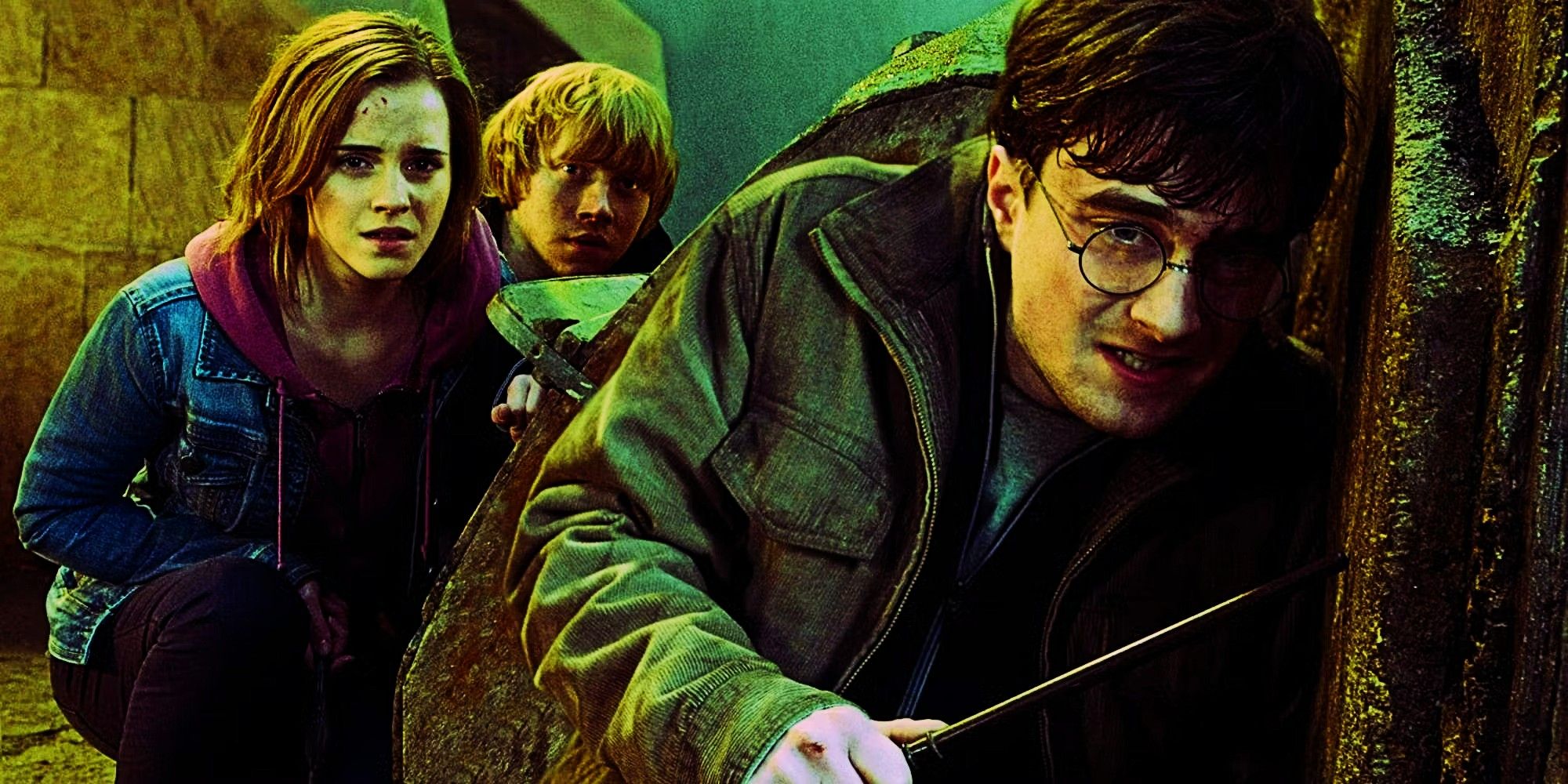 Daniel Radcliffe, Rupert Grint, and Emma Watson as Harry, Ron, and Hermione crouching on the ground during the Battle of Hogwarts in Harry Potter. 