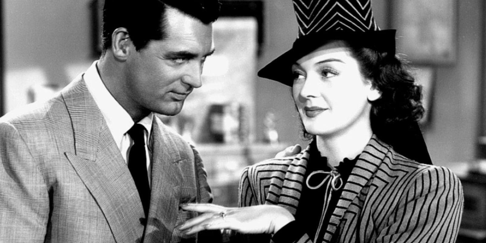 Hilda shows off her engagement ring to her ex-husband in His Girl Friday.