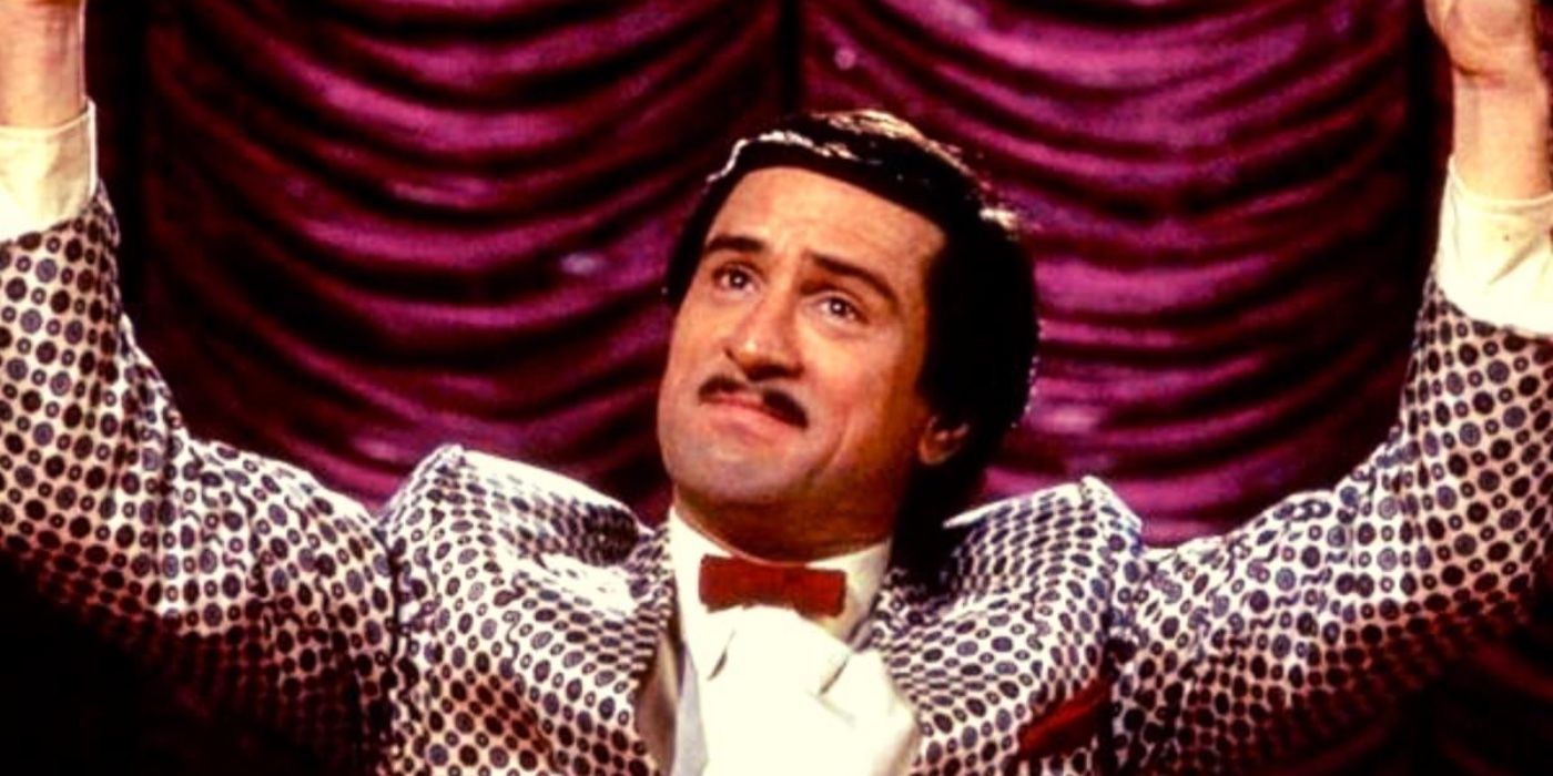 Rupert Pupkin (Robert De Niro) holding his arms up in The King of Comedy.