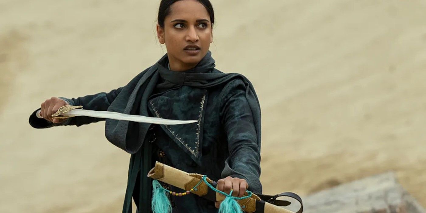 Amita Suman as Inej holding a sword in Shadow and Bone