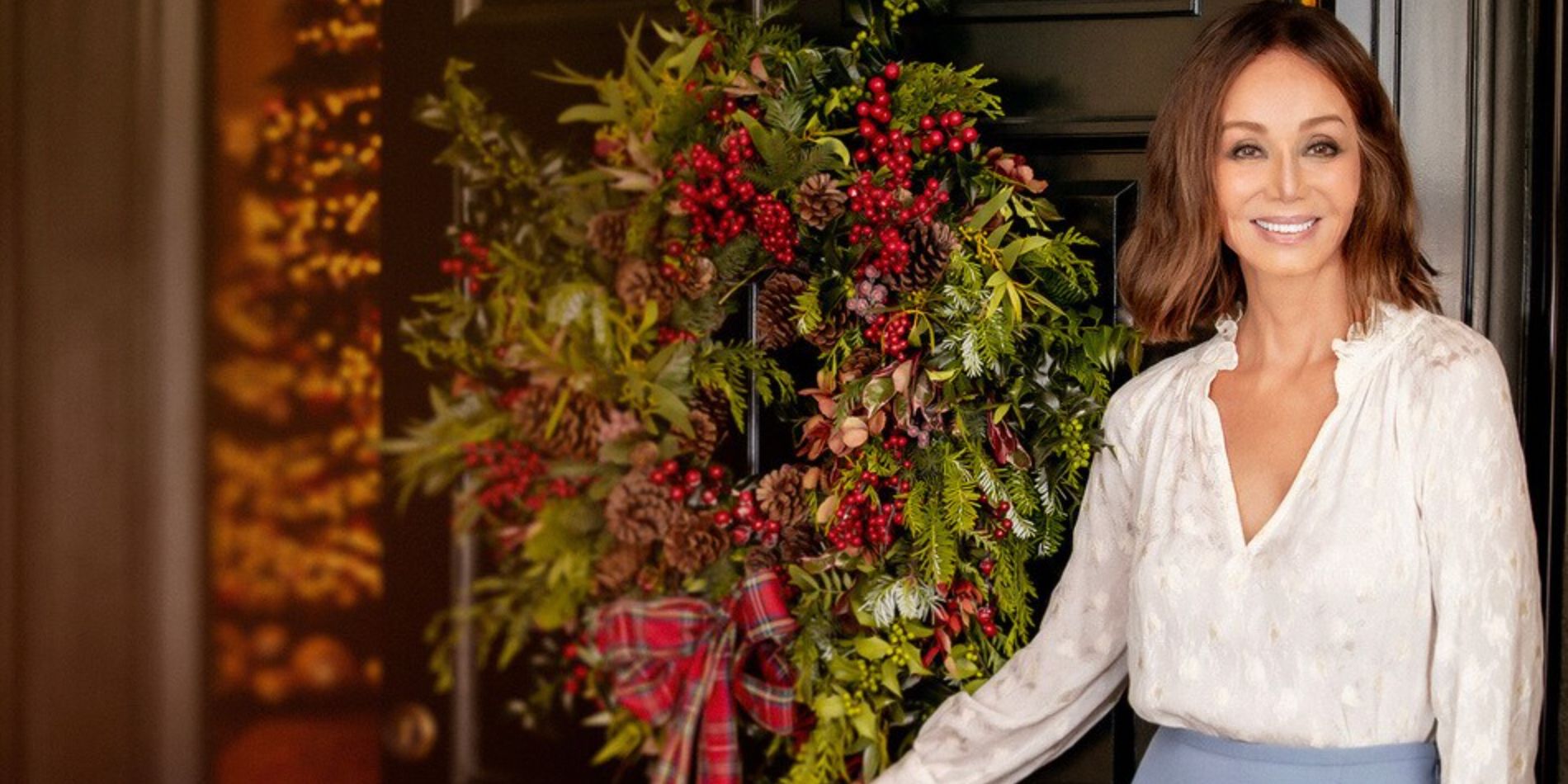 Isabel Preysler with a holiday wreath at her door in her Christmas special for Disney Plus