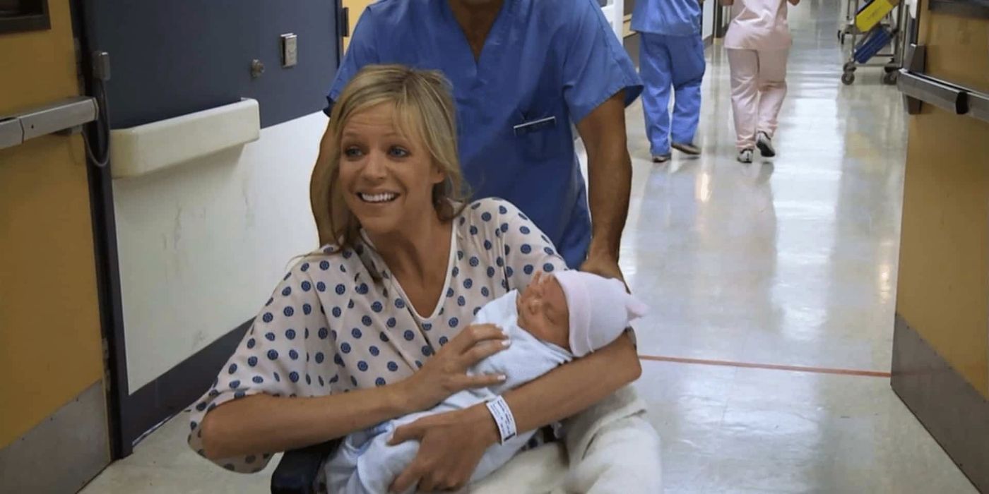 Dee holds a baby while being wheeled down a hospital hall in It's Always Sunny In Philadelphia 