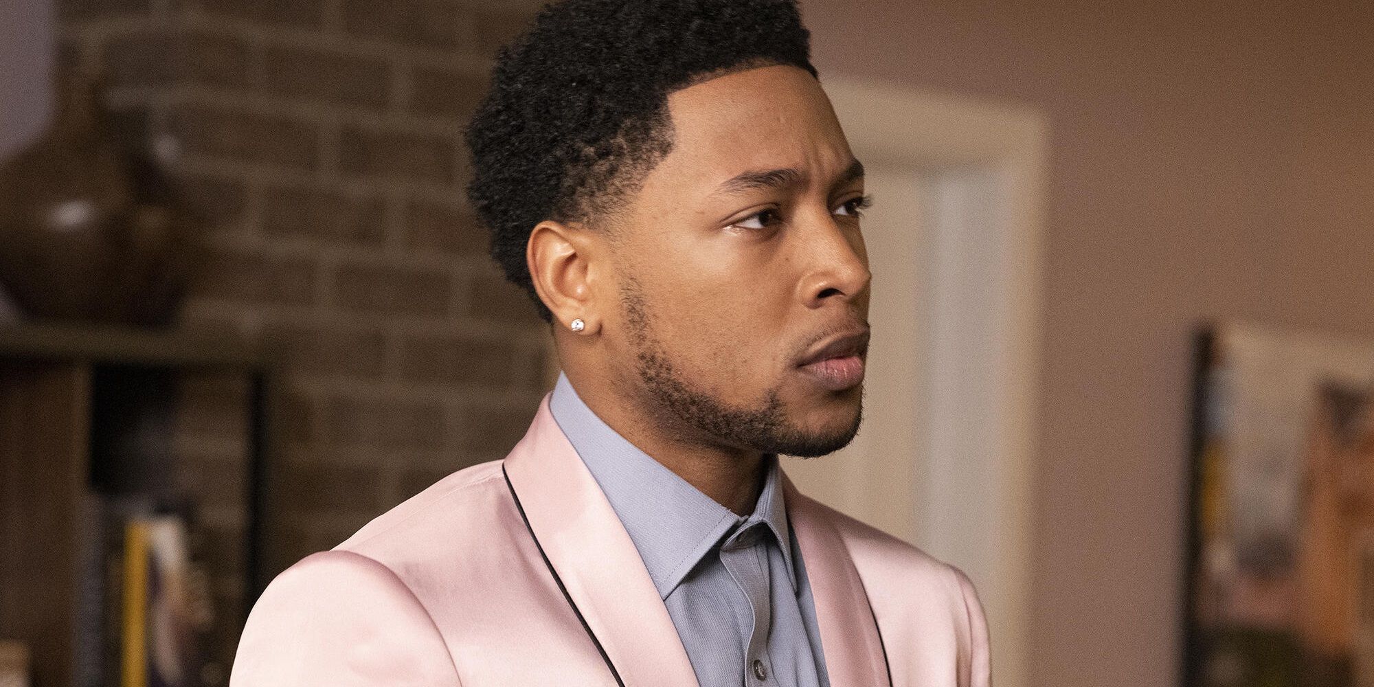 Jacob Latimore wearing a suit in The Chi