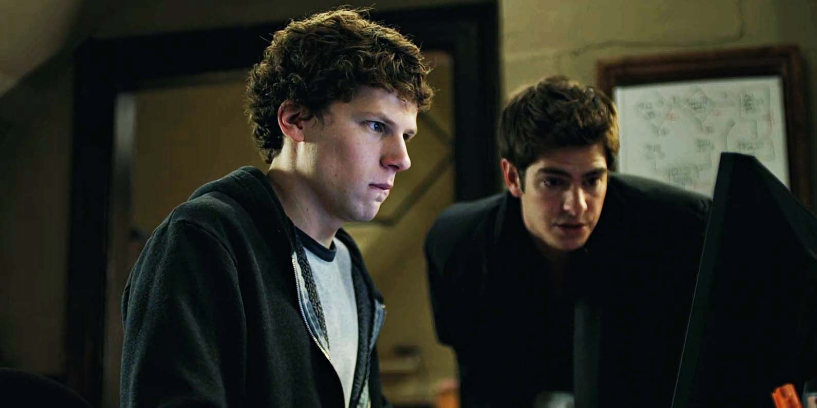 Mark Zuckerberg (Jesse Eisenberg) and Eduardo Saverin (Andrew Garfield) looking at a computer in The Social Network