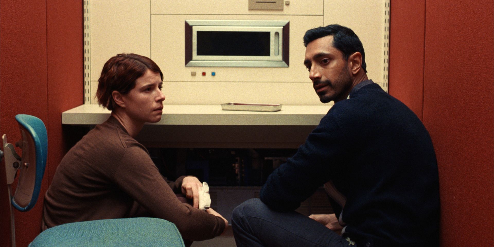 Jessie Buckley and Riz Ahmed looking dejected in Fingernails