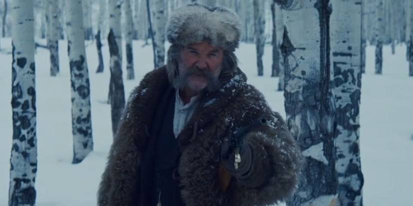 Kurt Russell as John Ruth yelling at Major Marquis Warren in a snowy forest in 2015's The Hateful Eight