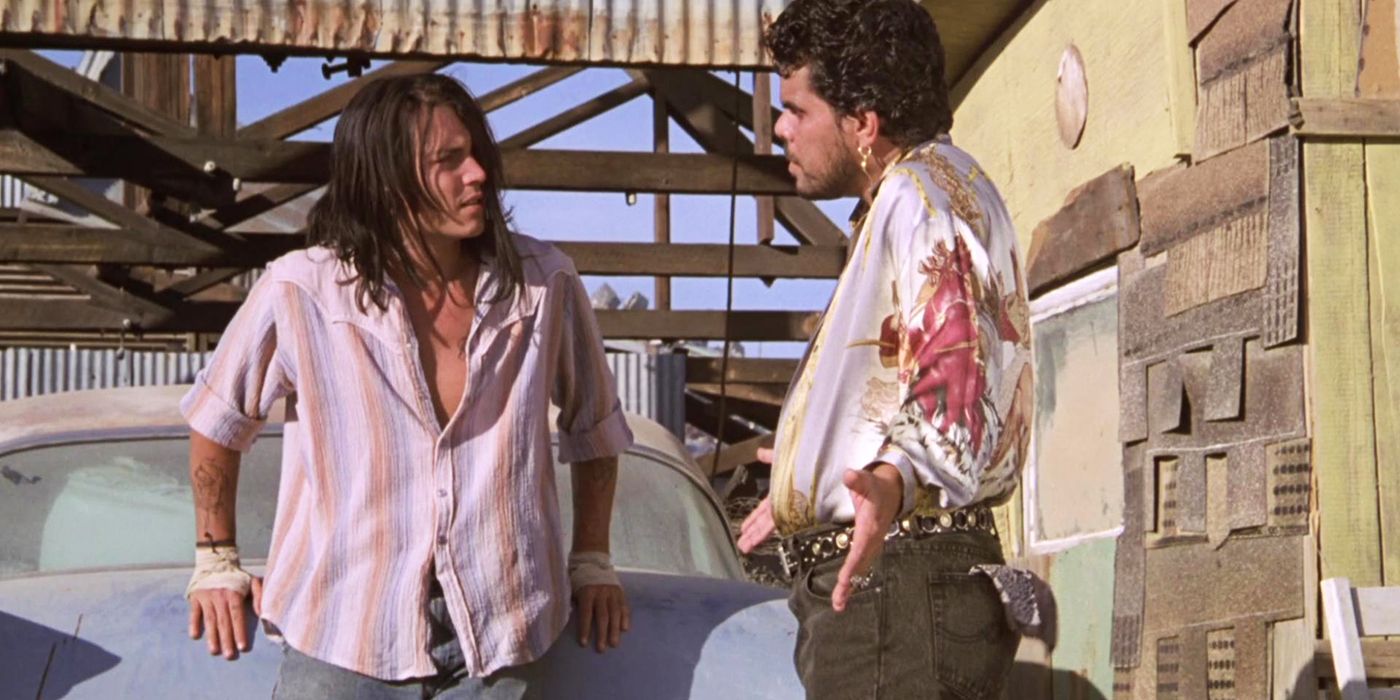 Johnny Depp and Luis Guzman talking in The Brave