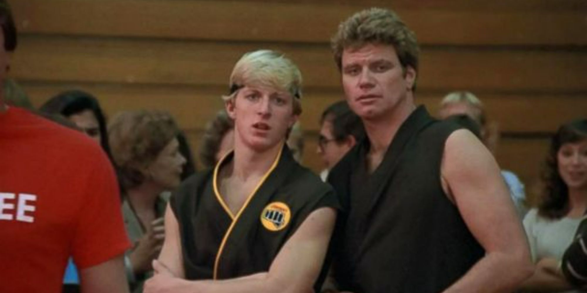 William Zabka as Johnny Lawrence and Martin Kove as John Kreese looking serious in The Karate Kid