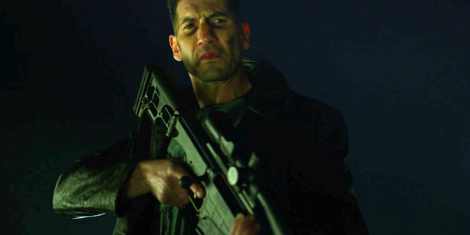 Punisher holds a large gun in his Netflix show.