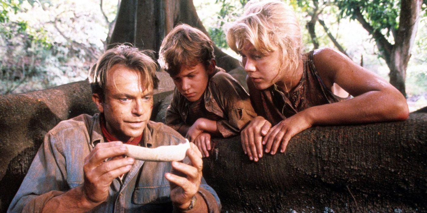 Alan, Tim, and Lex analyzing a bone in the jungle