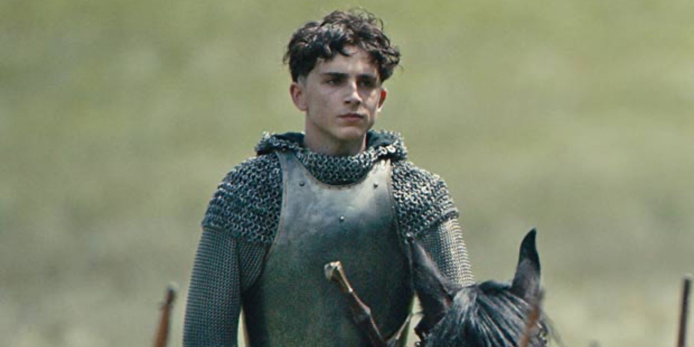 Timothée Chalamet as King Henry V, in a suit of armor in The King