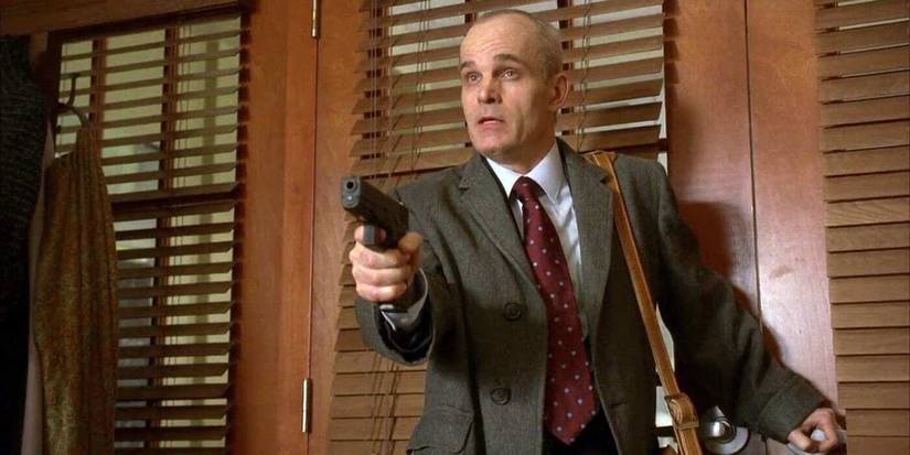 Jason, the gunman, pointing a gun at the hostages in Cuddy's office in House, M.D. "Last Resort."