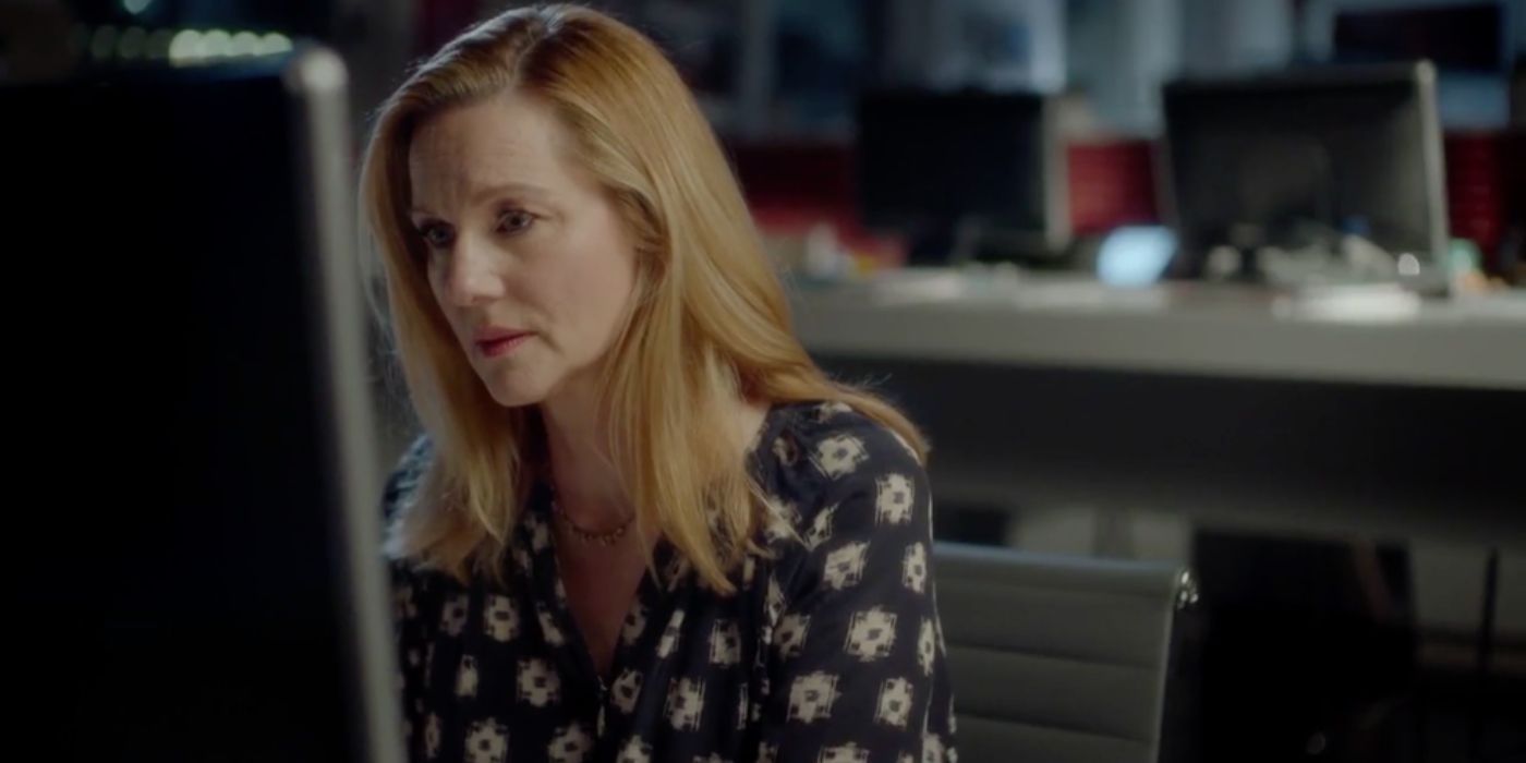 Laura Linney as Sarah at work on her computer in Red Nose Day Actually