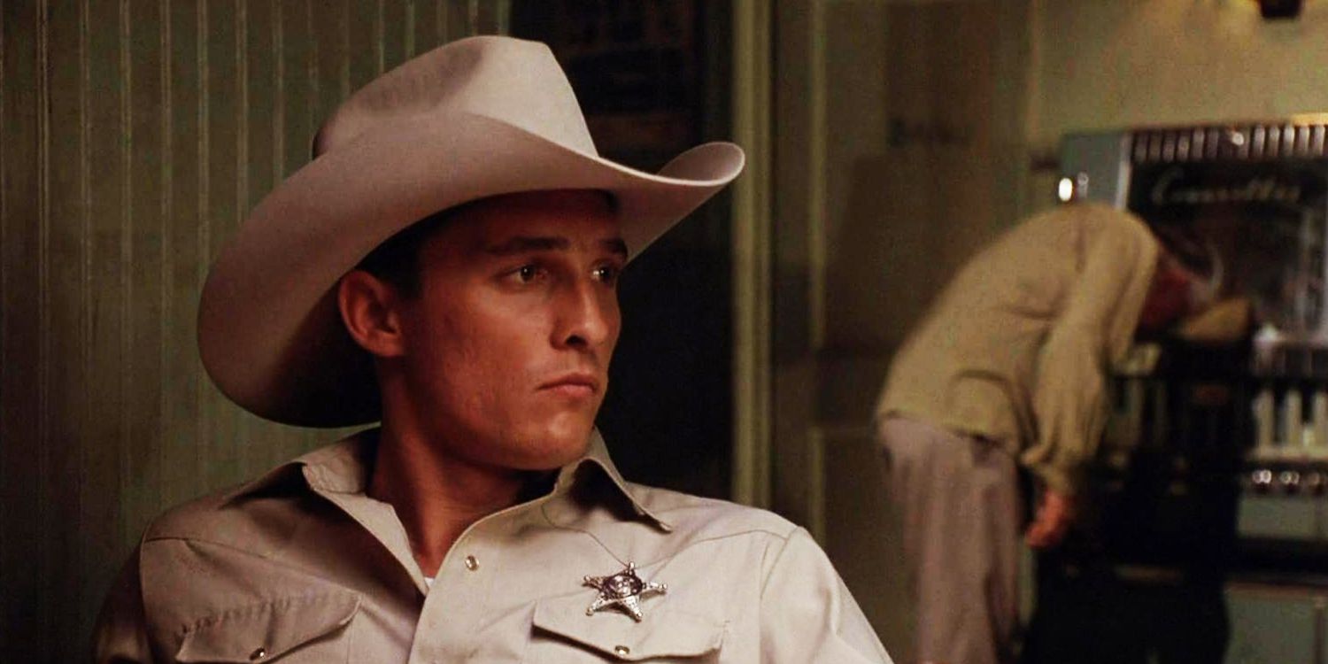 Matthew McConaughey as Buddy Deeds sitting in a saloon in Lonestar
