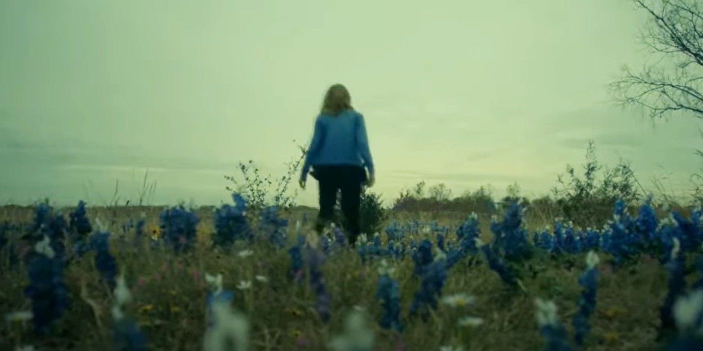 Madison standing in a field of blue flowers in Fear The Walking Dead