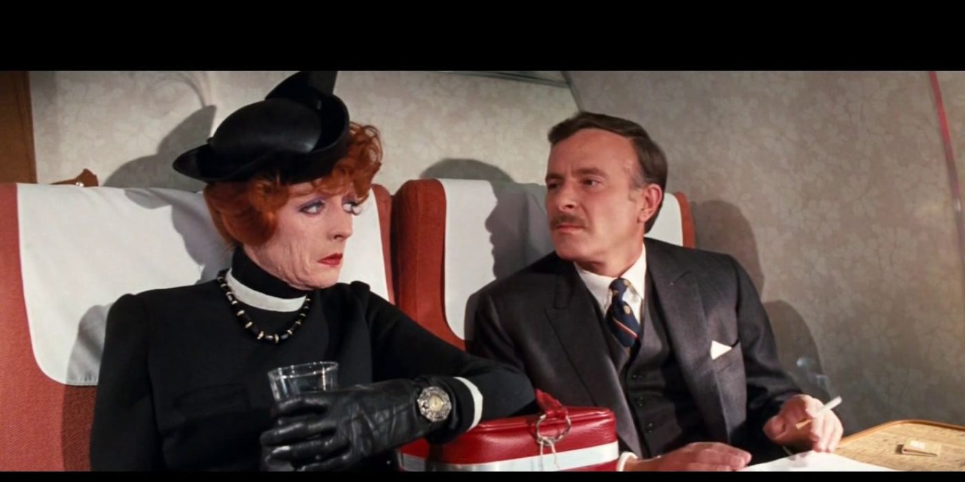 Maggie Smith as Aunt Augusta and Alec McCowen as Henry Pulling sitting next to each other in Travels With My Aunt
