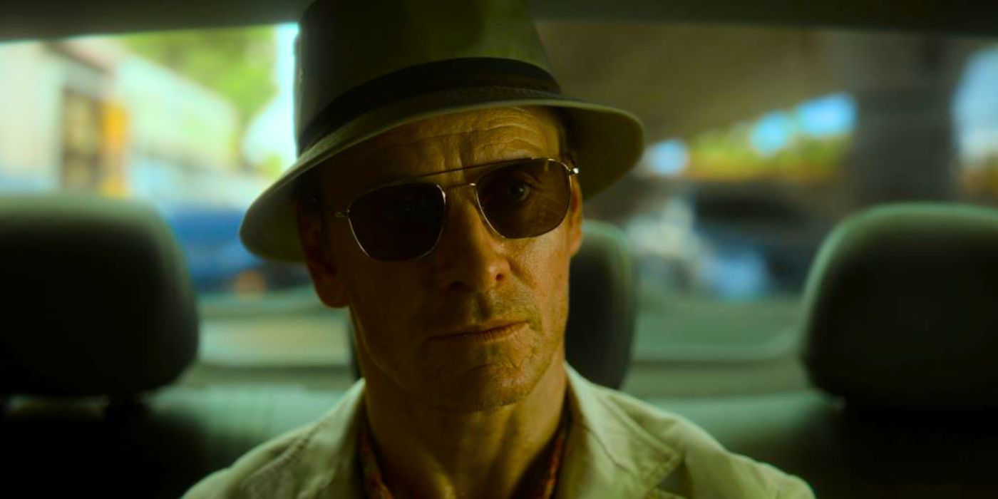 The Killer (Michael Fassbender) sits in a taxi in The Killer