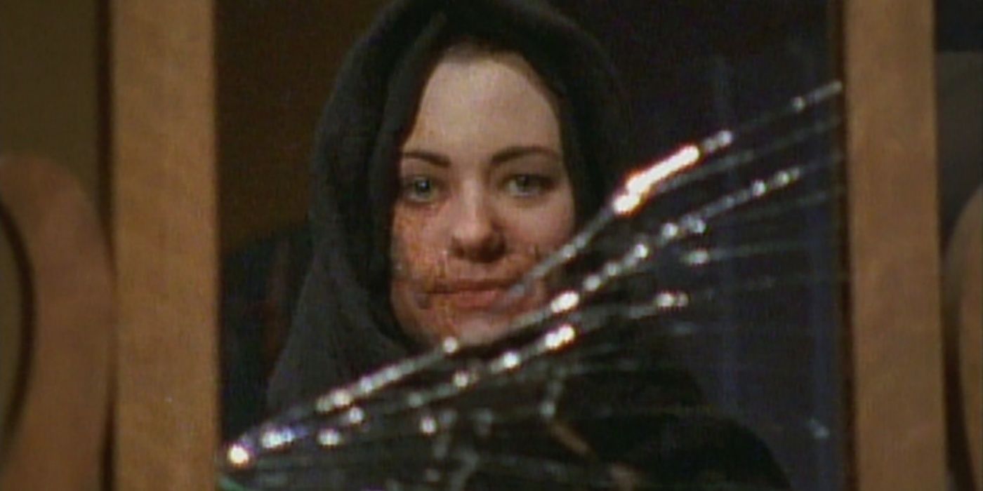 Marie looking in a broken mirror in The Tale Of The Vacant Lot.