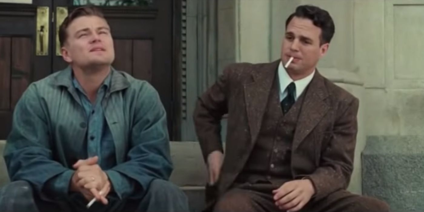 Mark Ruffalo sitting on steps with Leonardo DiCaprio in Shutter Island