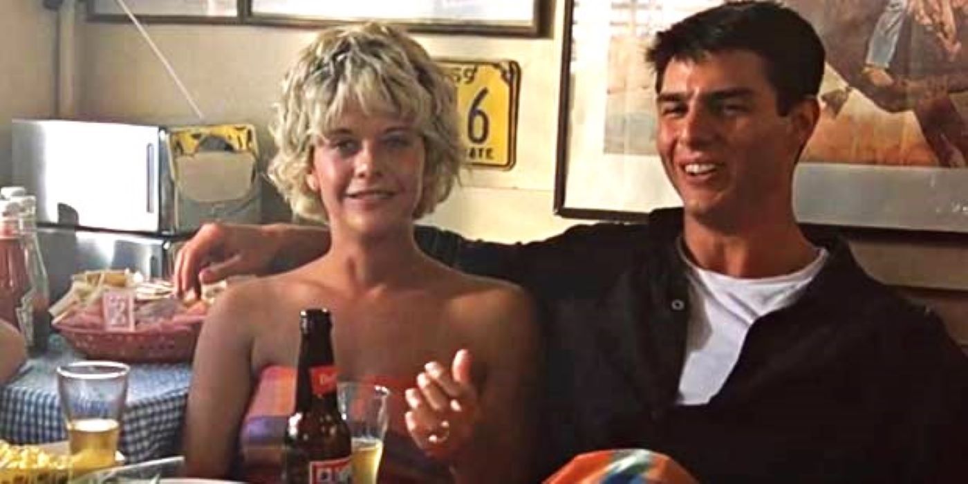 Meg Ryan And Tom Cruise sitting at a booth in Top Gun