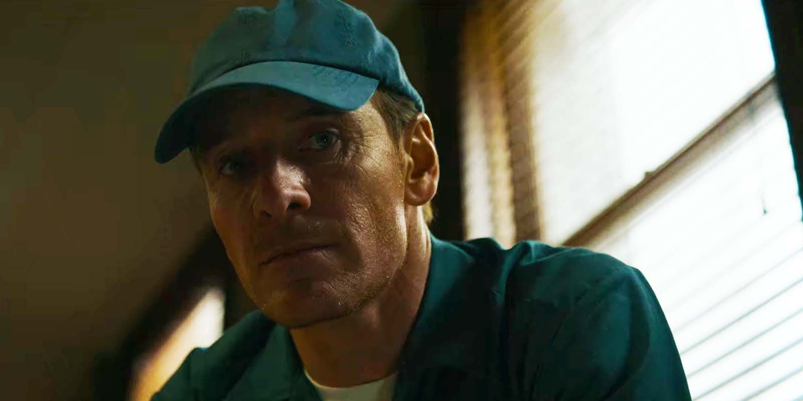 Michael Fassbender in disguise as a recycling collector in The Killer