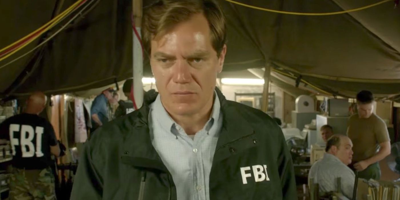 Michael Shannon as Gary Noesner walking away from an FBI tent concerend in Waco The Aftermath.