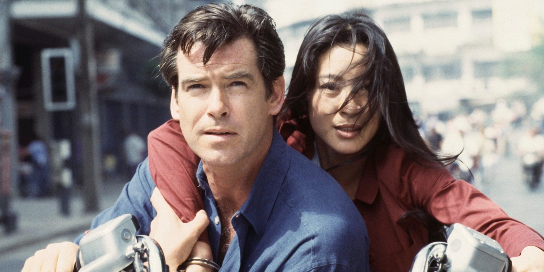 Michelle Yeoh and Pierce Brosnan on a motorcycle in Tomorrow Never Dies