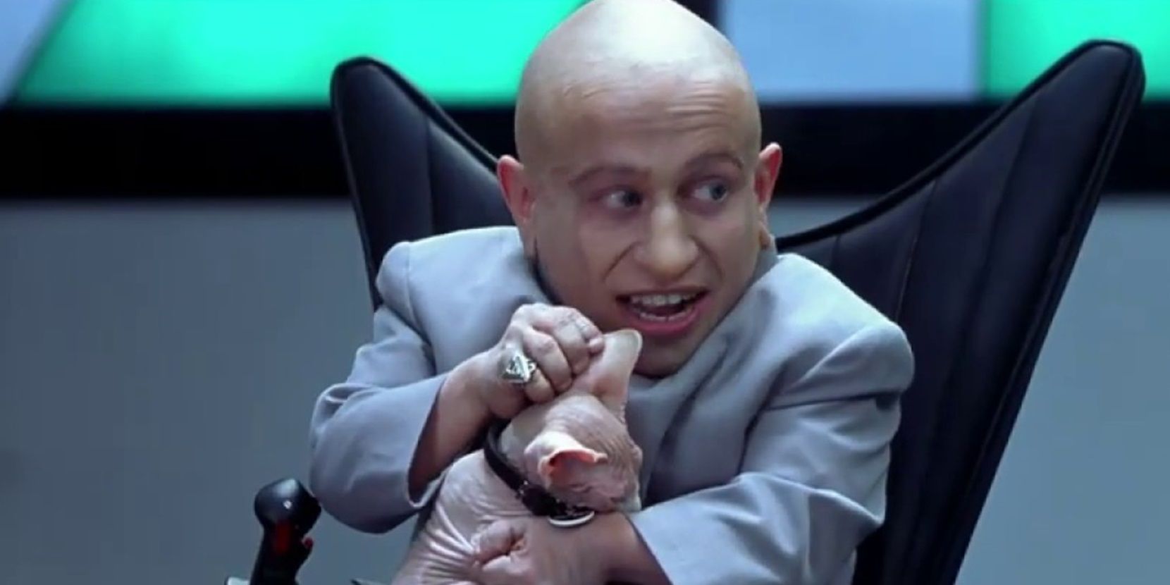 Mini-Me (Verne Troyer) pets Dr Evil's cat in Austin Powers in Goldmember