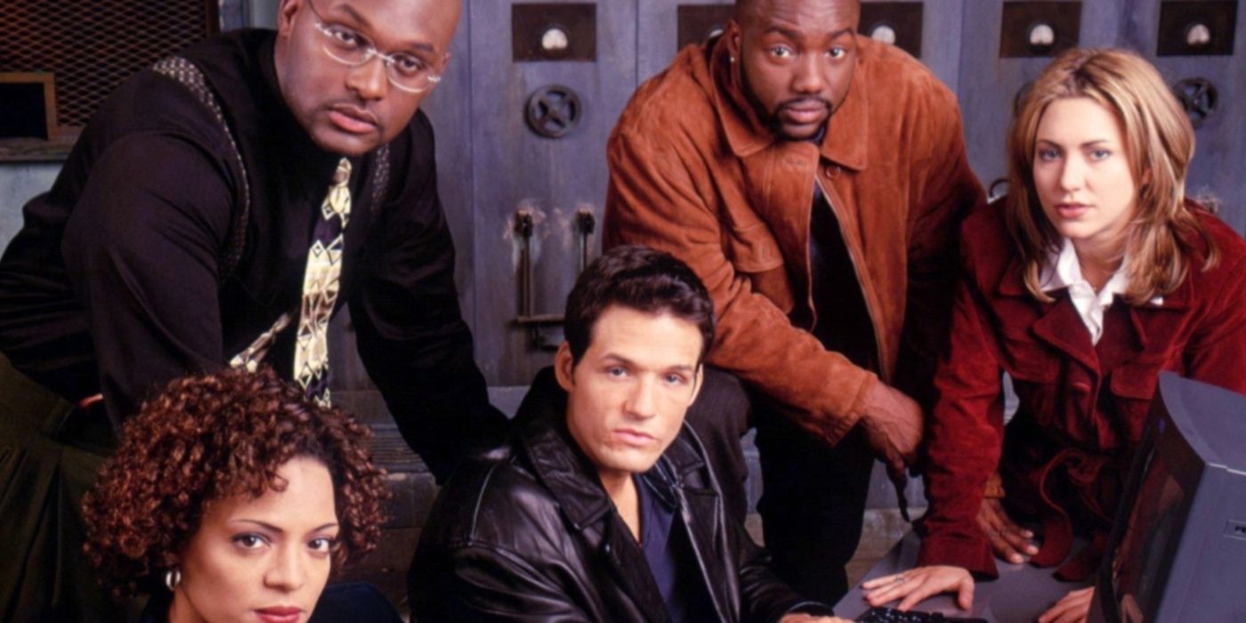 The cast of New York Undercover lean over a table