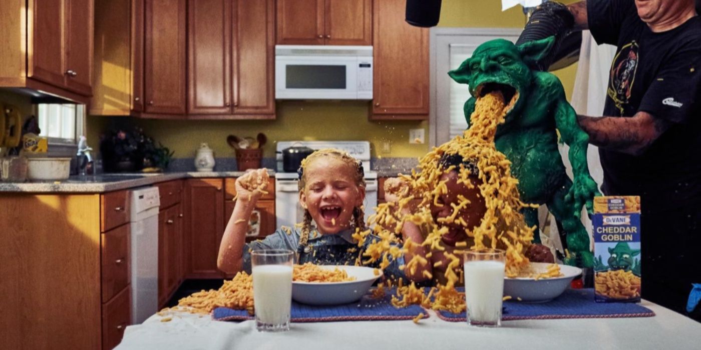 A child being vomited on by the Cheddar Goblin in Mandy