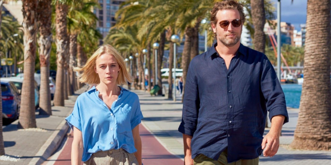 Miranda Blake (Elen Rhys) and Max Winter (Julian Looman) walk along the beach in The Mallorca Files