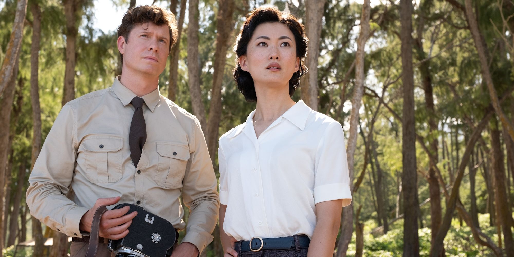 Keiko and Bill look up at something while standing in the woods in Monarch: Legacy of Monsters