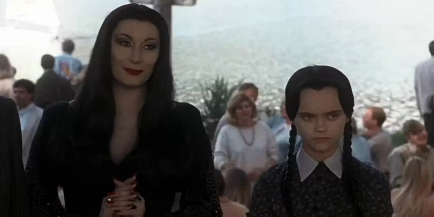 Morticia with Wednesday Addams.