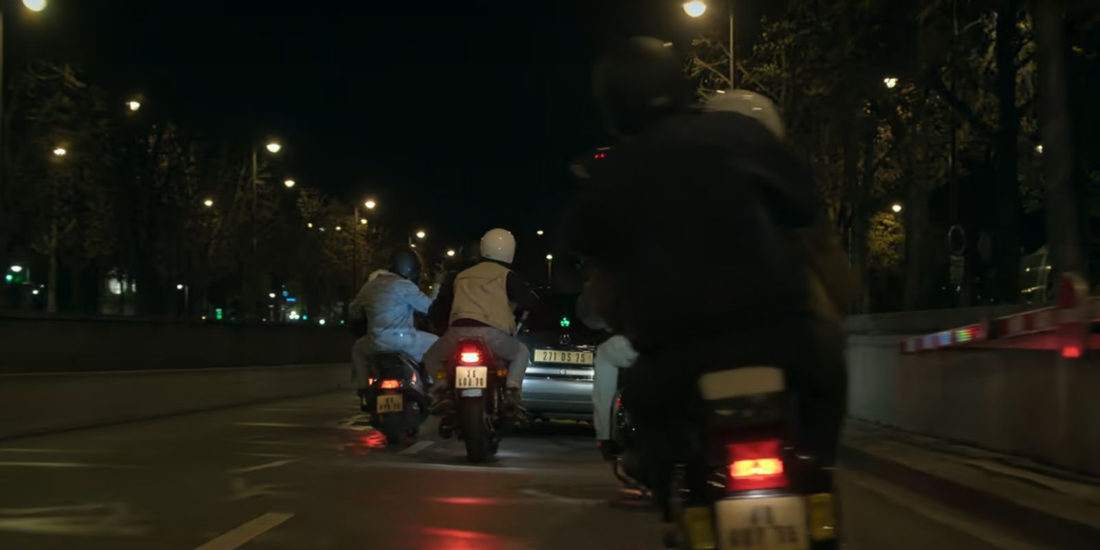 Paparazzi on motorbikes follow Princess Diana's car in The Crown season 6.