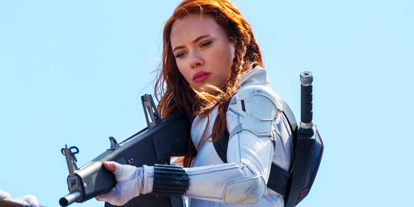 Natasha Romanoff in white costume with gun at the Seventh Circle prison in Black Widow