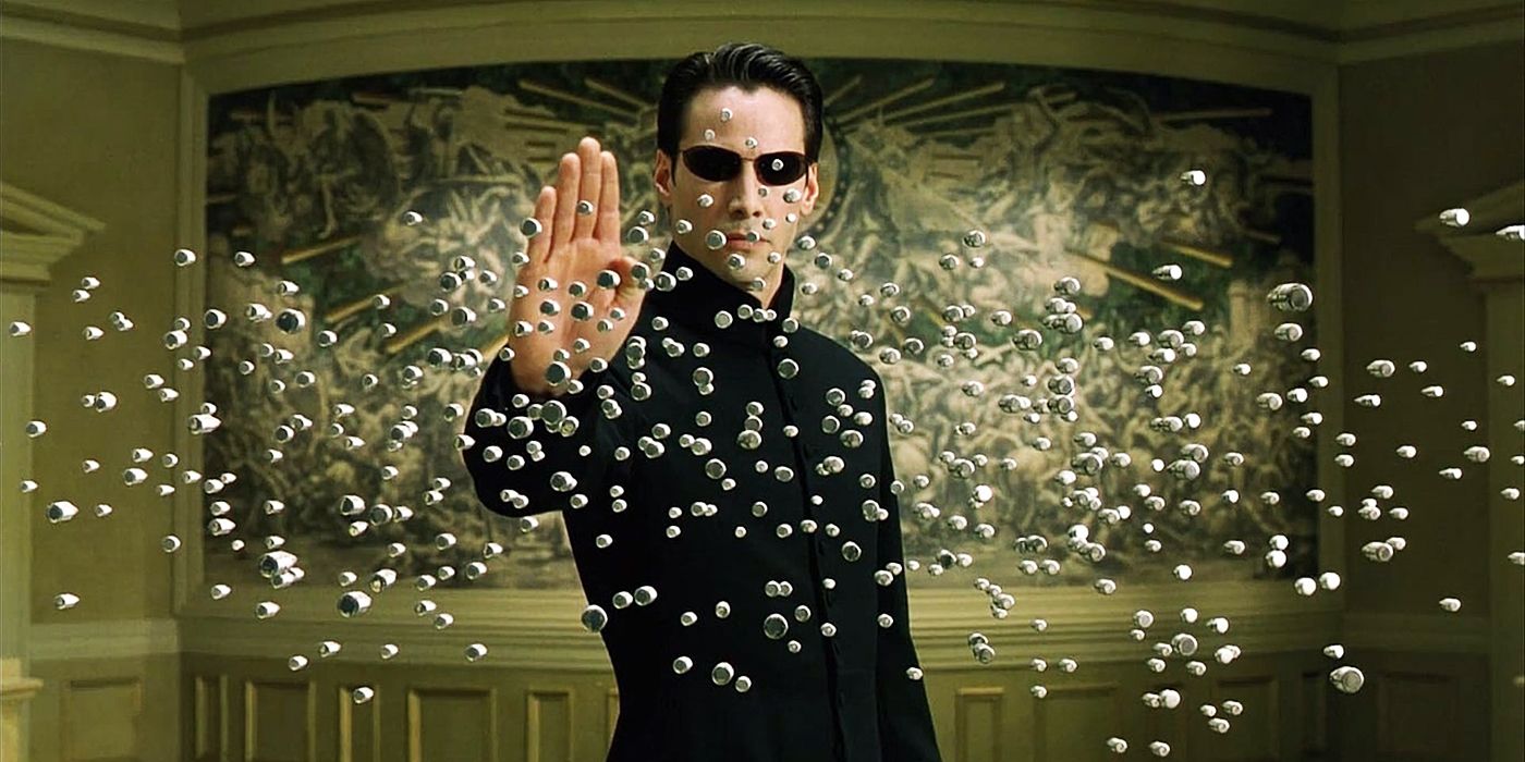 Neo halting bullets in mid-air while preparing to fight a group of armed men in The Matrix Reloaded