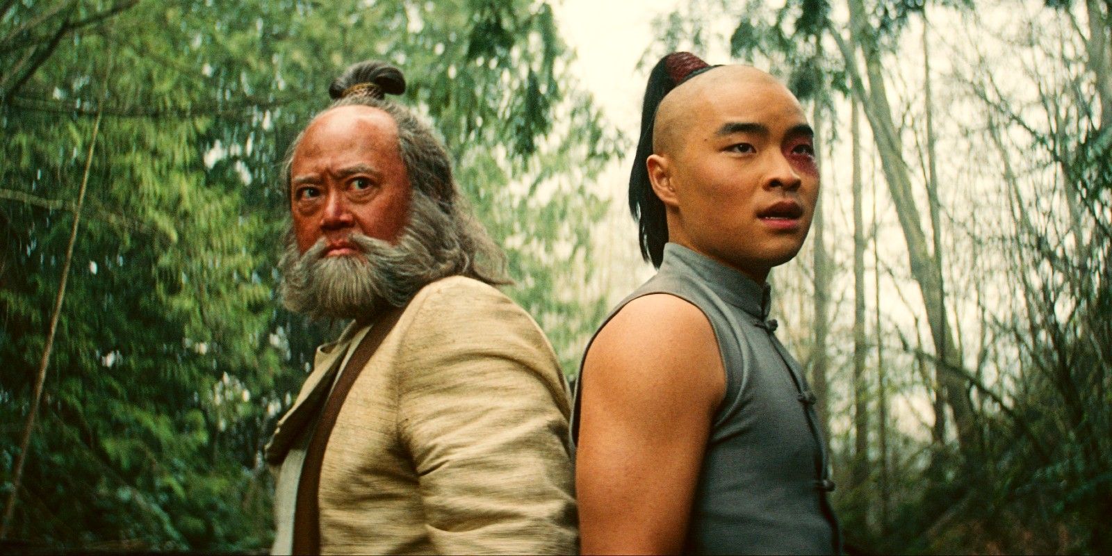 Netflix's Uncle Iroh and Zuko standing back to back in Avatar the Last Airbender