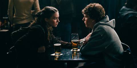 Rooney mara and jesse eisenberg talking intimately at a bar in the social network