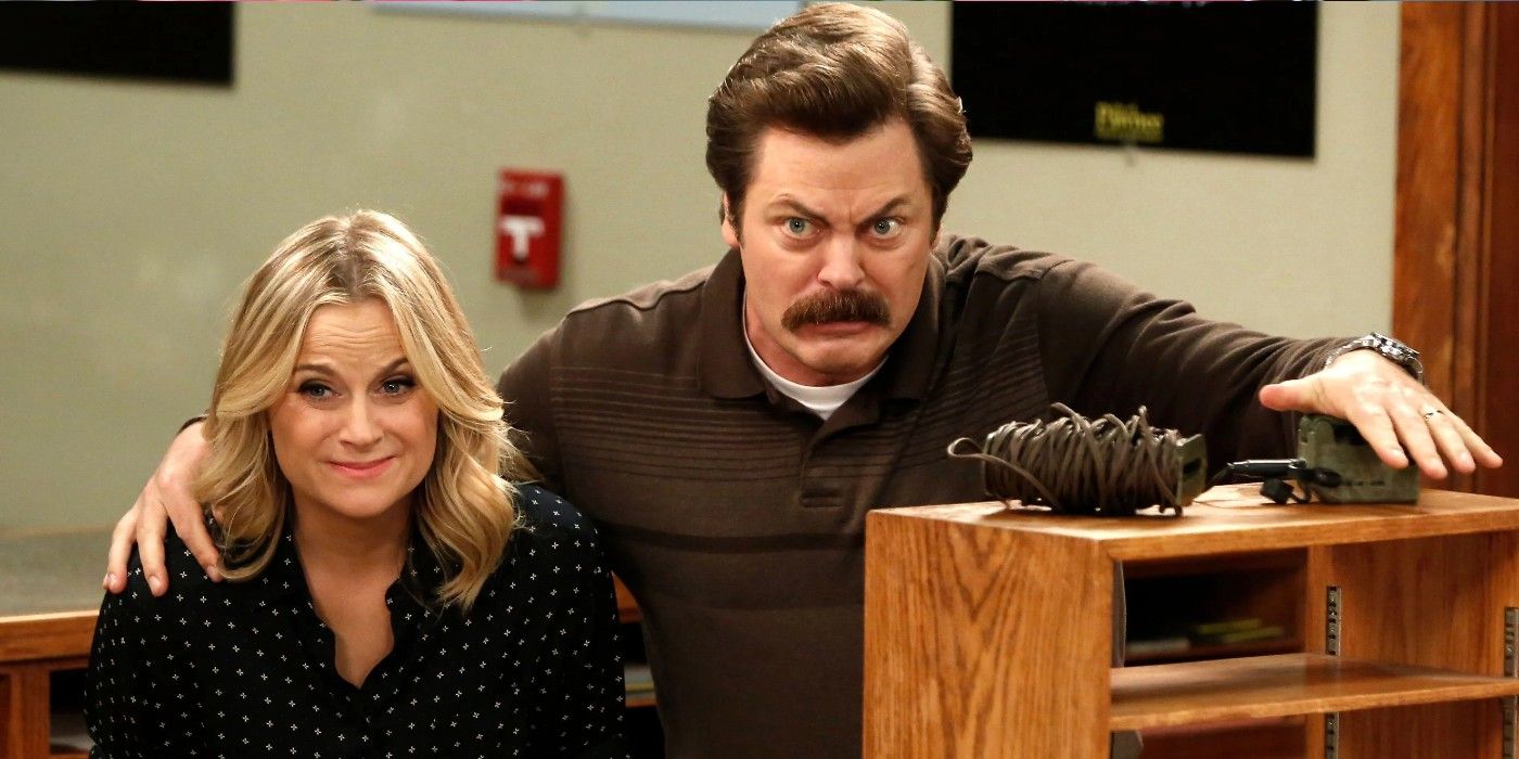 Amy Poehler and Nick Offerman as Leslie Knope and Ron Swanson preparing to explode a mine in Parks and Recreation