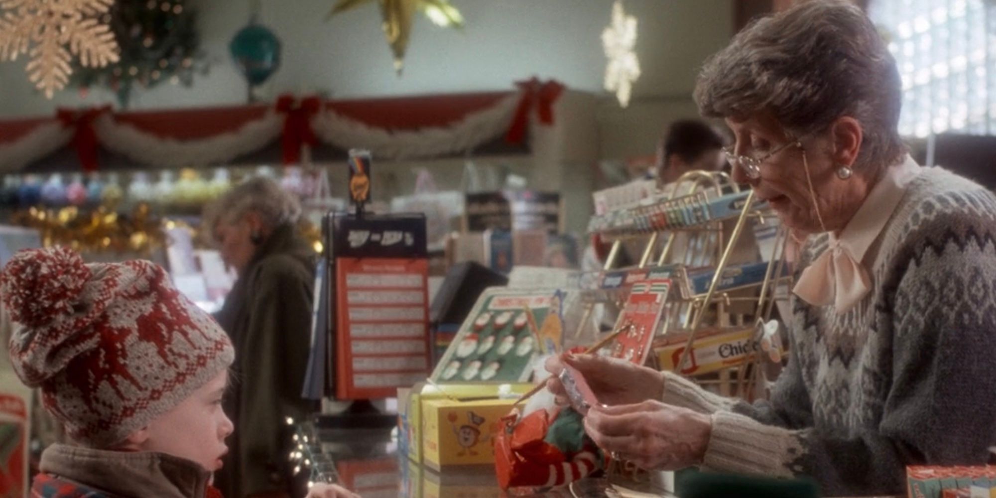 Macaulay Culkin as Kevin McCallister at the pharmacy in Home Alone