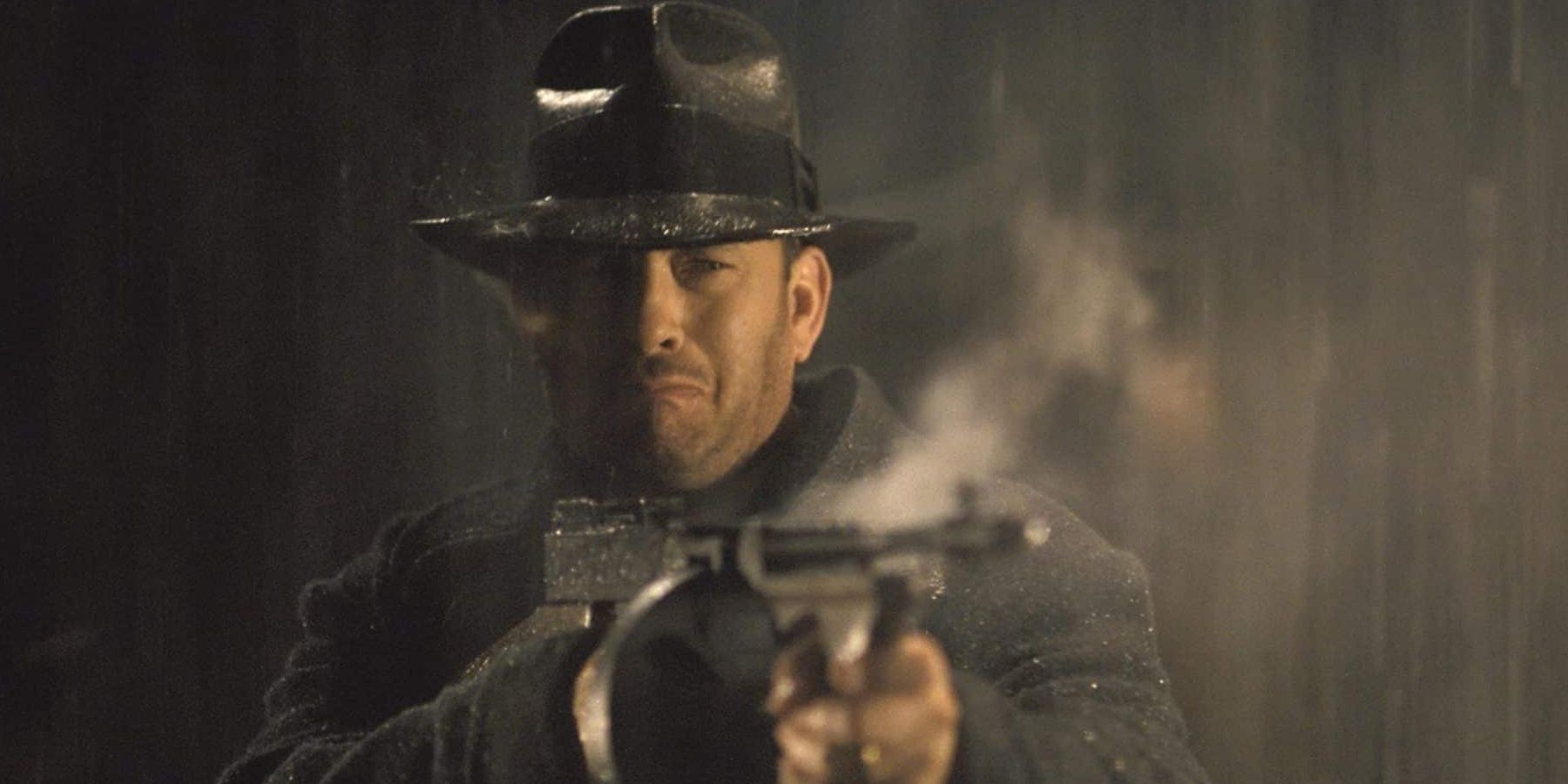 Michael Sullivan (Tom Hanks) firing a tommy gun in Road to Perdition