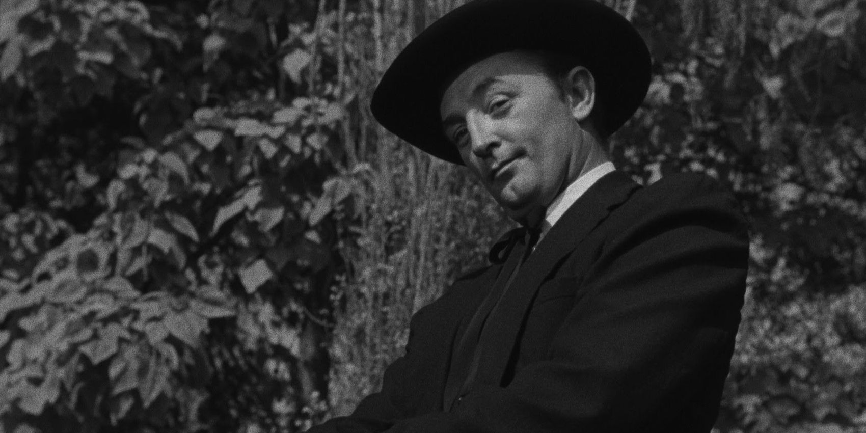 Robert Mitchum with an eyebrow raised in The Night of the Hunter