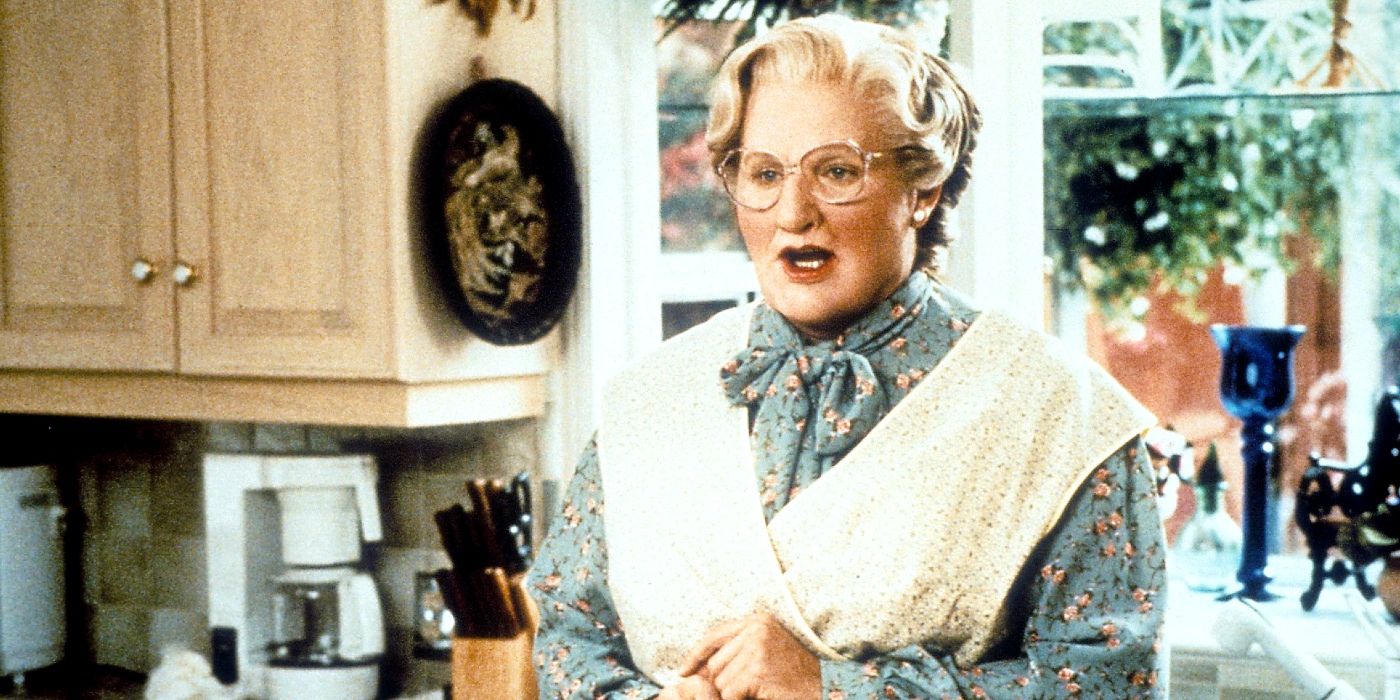 Robin Williams as Mrs. Doubtfire with his mouth slightly agape.