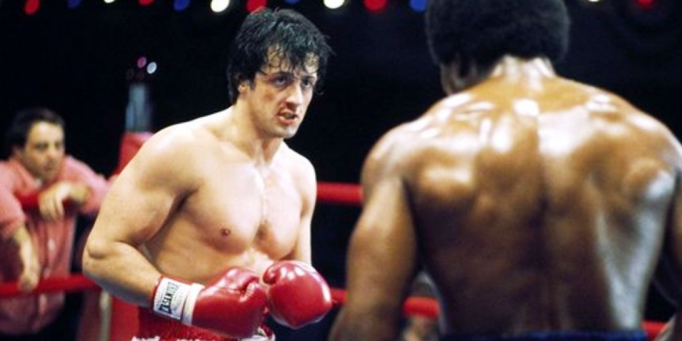 Sylvester Stallone as Rocky squaring up to fight Carl Weathers' Apollo Creed in Rocky.