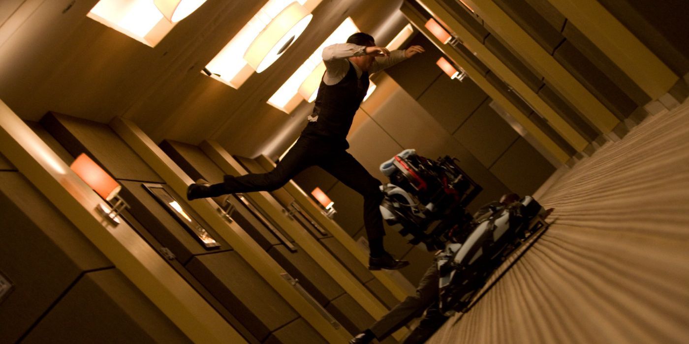 Joseph Gordon-Levitt as Arthur fighting in the rotating hallway scene of Inception